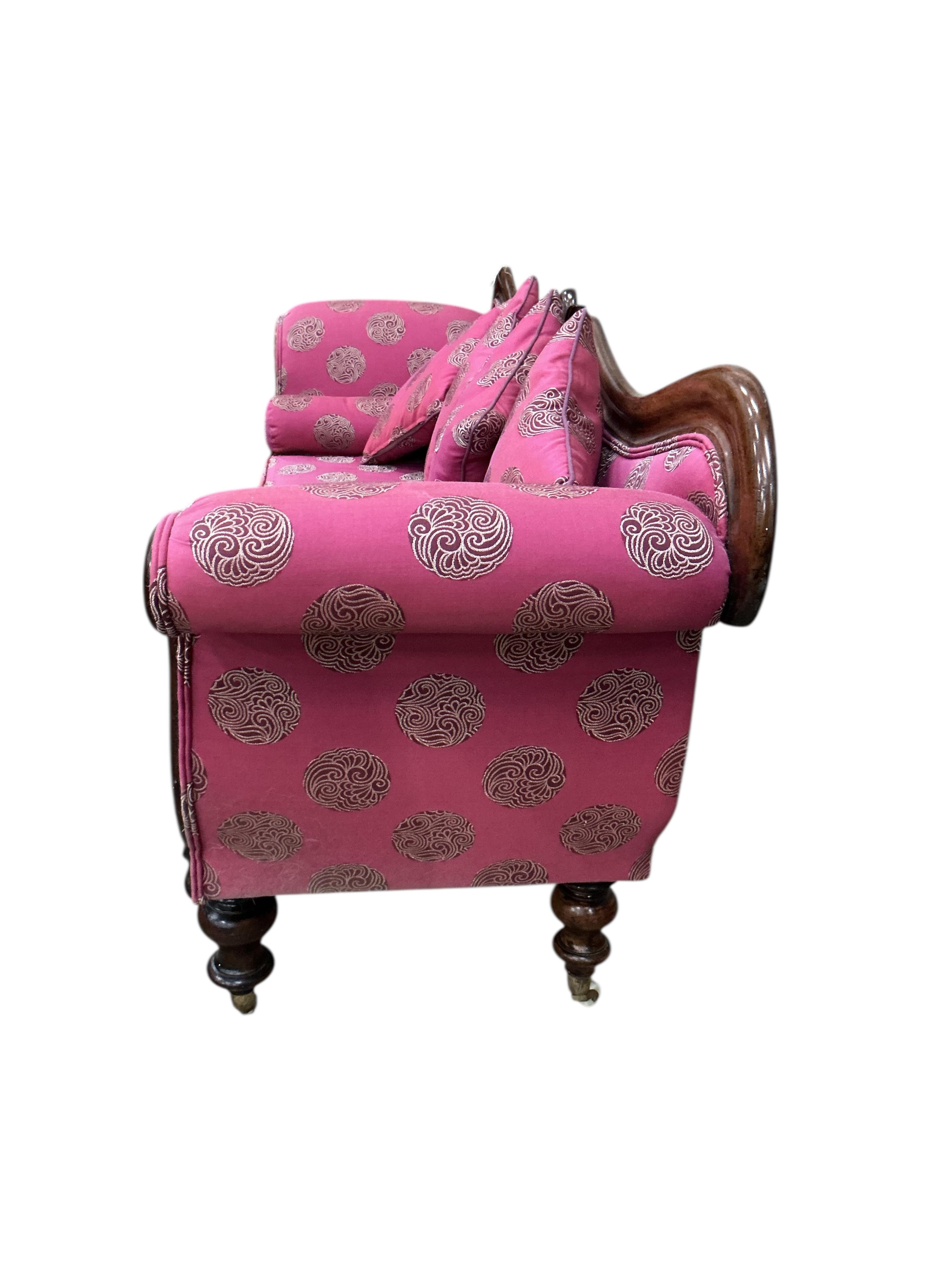 A Victorian mahogany scroll arm settee, width 200cm, depth 55cm, height 86cm